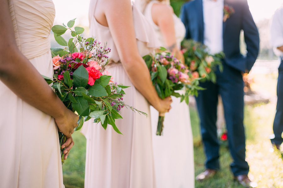 Bridal Party Portrait with Blush Pink Bella Bridesmaids Bridesmaids Dresses with Greenery Accented Bouquet