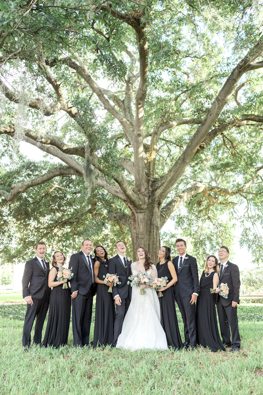 Outdoor Lakeland Wedding Party Portrait | Black Paper Crown Bridesmaids Dresses with Hayley Paige Wedding Gown
