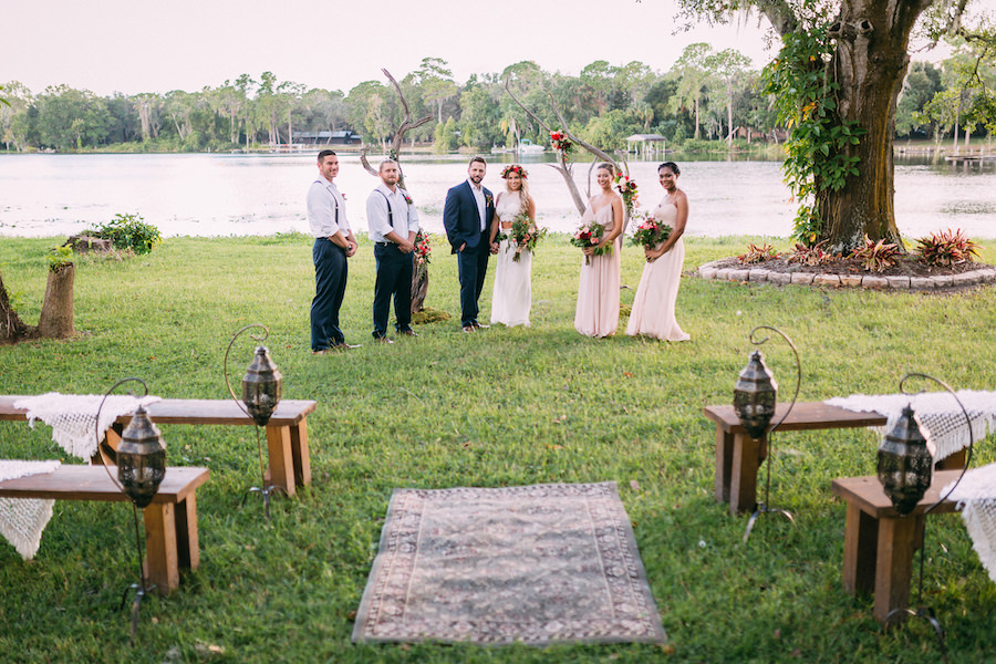 Outdoor Tampa Bridal Party Wedding Portrait | Blush Pink Bella Bridesmaid Dresses | Outdoor Tampa Bay Lakefront Wedding Venue The Barn at Crescent Lake | Waterfront Wedding Ceremony with Farm Benches from Ever After Vintage Weddings