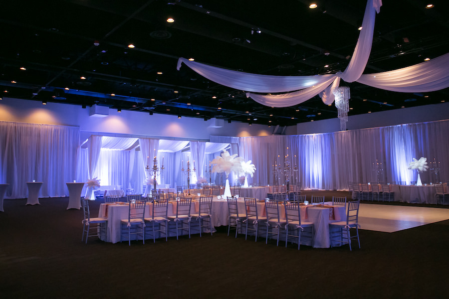 Purple Uplighting and Pin-spotting Lighting Effects for Florida Modern Wedding Reception with Drapery and Chiavari Chairs with Feather Decor by Tampa Event Rental Company Gabro Event Services