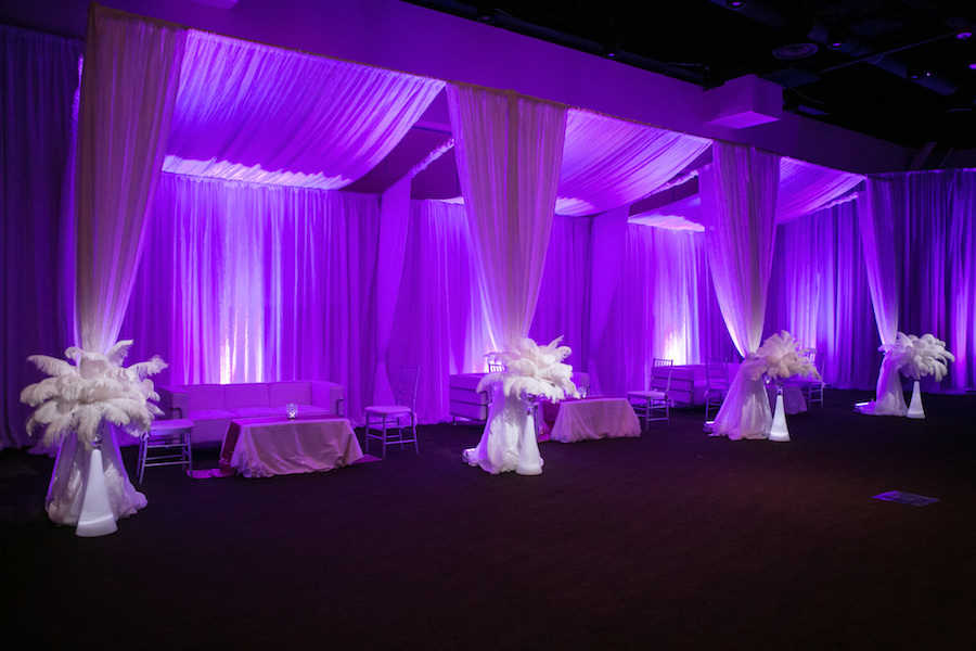 Modern Lounge Seating Option for Wedding Reception | Purple Uplighting and Pin-spotting Lighting Effects for Florida Modern Wedding Reception with Drapery by Tampa Event Rental Company Gabro Event Services