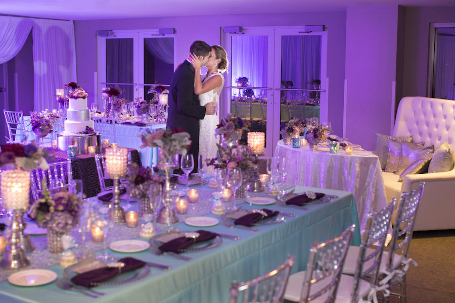 Beaded Glass Charger with Silver Wedding Menu and Purple Napkin with Rhinestone Holder | Purple and Deep Red Centerpieces with Candles on Tiffany Blue Linens with Clear Chiavari Chairs | Wedding Reception Ideas & Inspiration | Special Moments Event Planning | Connie Duglin Linens | Gabro Event Services | Djamel Photography