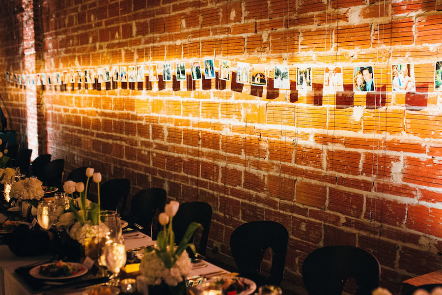 Wedding Photo Reception Display Idea Hanging On Brick Wall | Modern St. Petersburg Wedding Venue NOVA 535