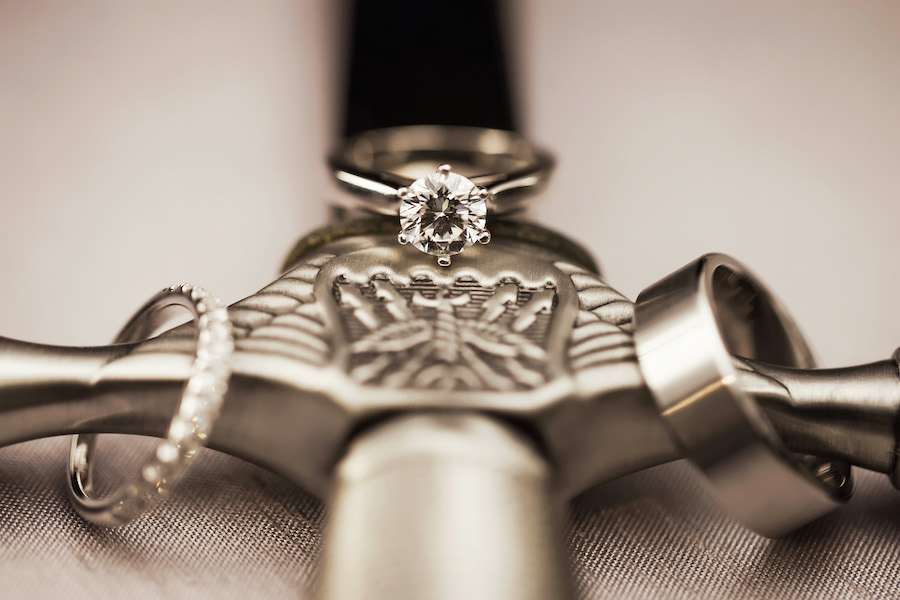 Military Bride and Groom Wedding and Engagement Ring Portrait on Air Force Sword | St. Pete Florida Wedding Photographer Limelight Photography
