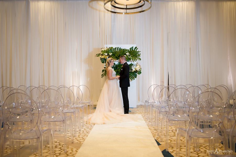 Bride and Groom Wedding Ceremony Portrait with Ghost Chairs | Clearwater Beach Wedding Venue | Wyndham Grand Clearwater Beach