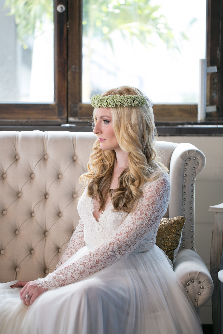 Vintage Tufted Upholstered Couch and Boho Bride with Baby's Breath Floral Crown | Long Sleeved Lace Wedding Dress from the The Bride Tampa | Boho Wedding Reception Decor Ideas and Inspiration | Tampa Wedding Photographer Carrie Wildes Photography