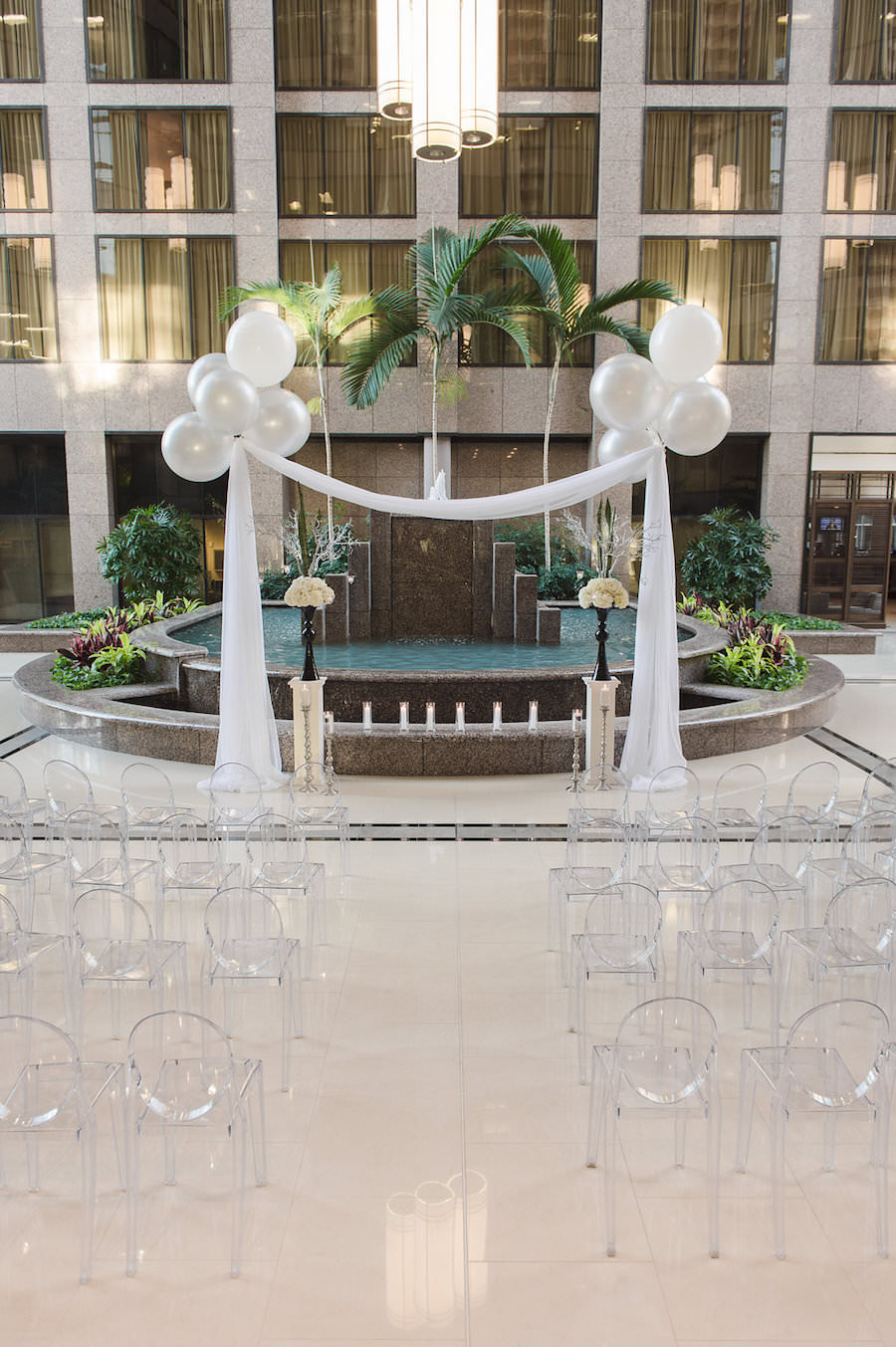 Modern Wedding Ceremony with Ghost Chairs and Large Balloons with Drapery | Modern Tampa Wedding Venue Centre Club Tampa