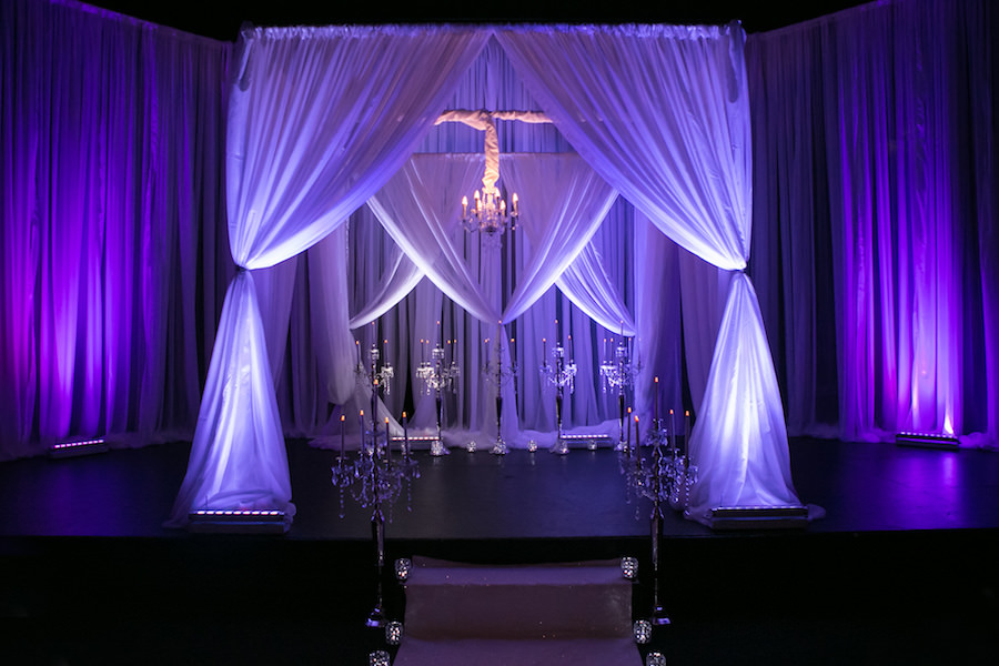 Purple Uplighting and Pin-spotting Lighting Effects for Florida Modern Wedding Ceremony with Drapery by Tampa Event Rental Company Gabro Event Services
