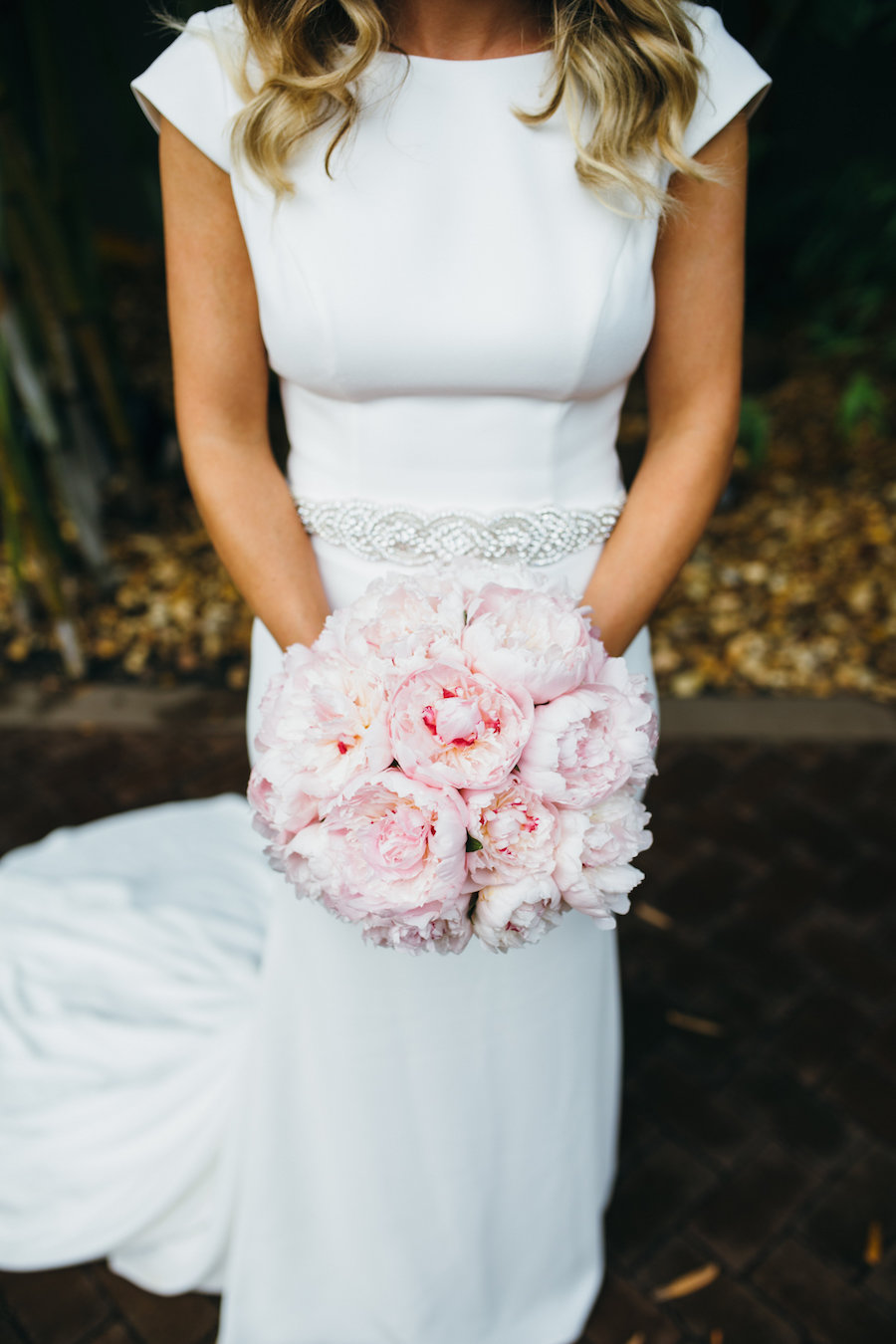 Bridal Wedding Portrait in Ivory, Cap Sleeve Sheath Mikaella Wedding Dress with Rhinestone Belt and Blush Pink Peony Wedding Bouquet