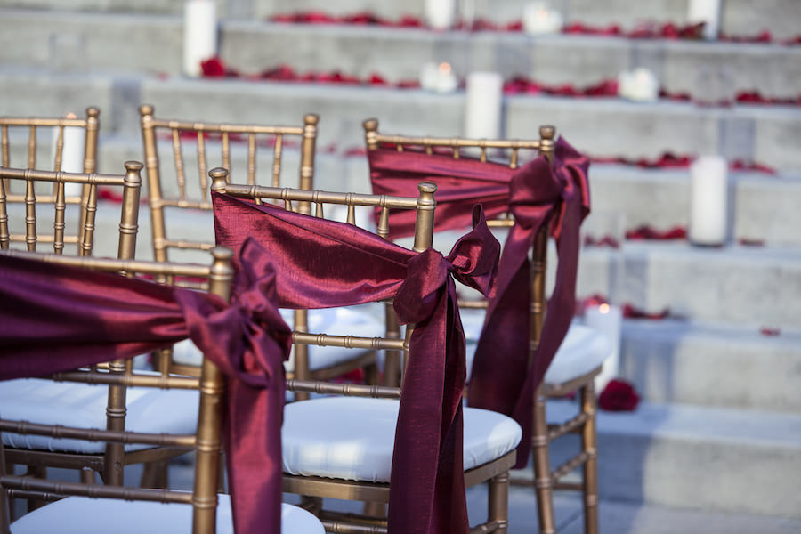 Outdoor, Wedding Ceremony Decor with Gold Chiavari Chairs and Maroon Chair Sashes | Tampa Chair Rentals Signature Event Rentals