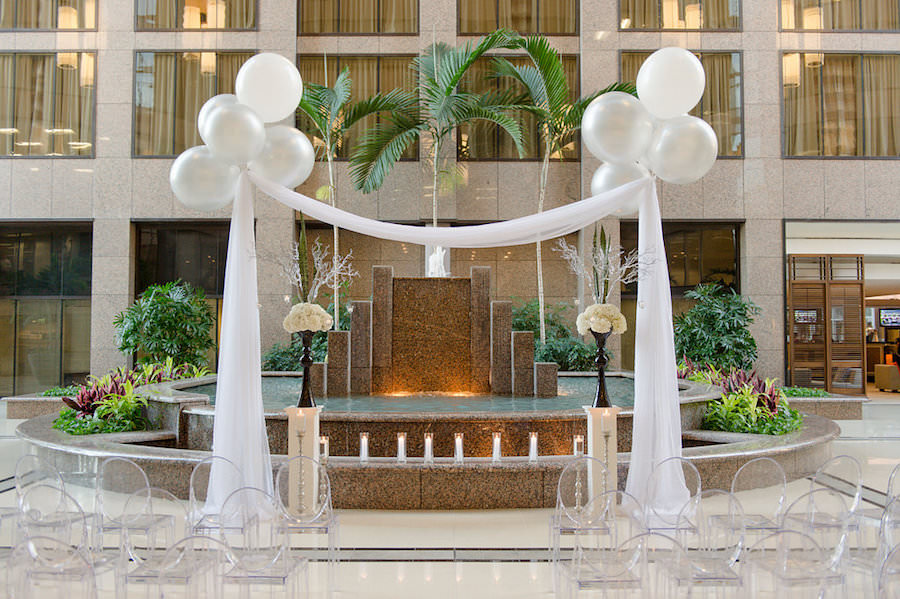 Modern Wedding Ceremony with Ghost Chairs and Large Balloons with Drapery | Modern Tampa Wedding Venue Centre Club Tampa