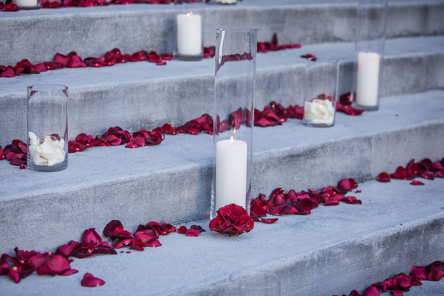 Rose Petals and Tall Candles at Outdoor Wedding Ceremony on Stairs