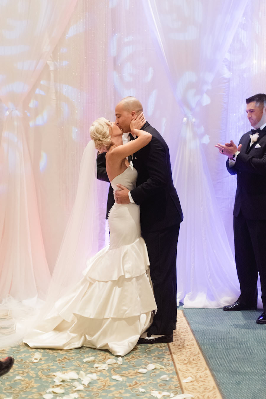 Bride and Groom Wedding Ceremony First Kiss