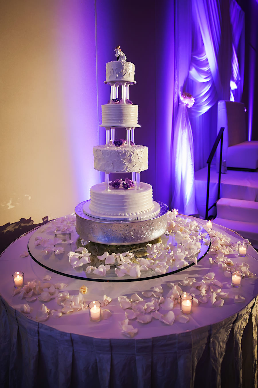 Four Tiered, Round, White Wedding Cake with White Rose Petal Accents