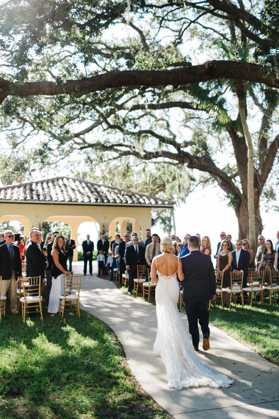 Bride and Dad Walking Down Aisle at Outdoor Sarasota Wedding Ceremony at the Powel Crosley Estate | Sarasota Wedding Planner Nicholle Leonard Designs