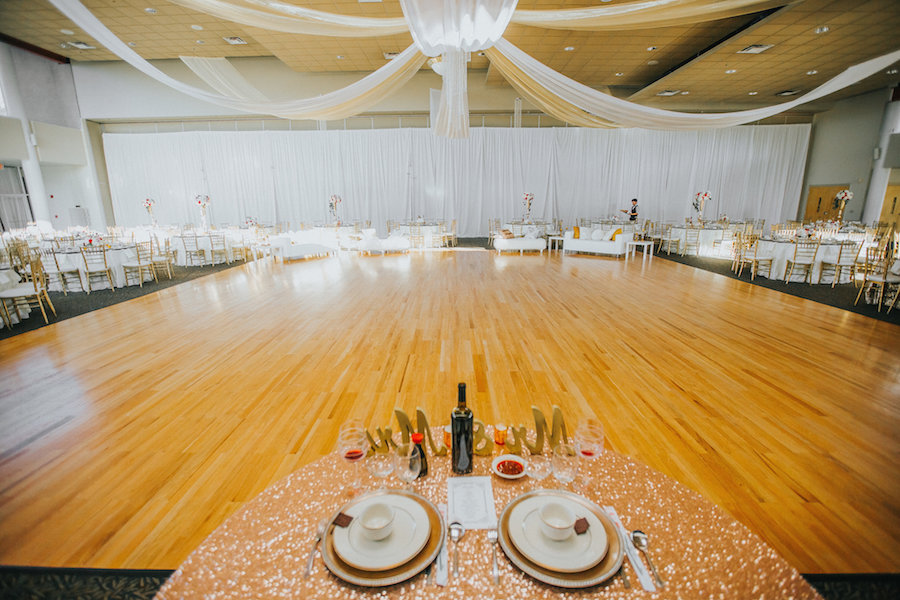 White Wedding Reception with Ceiling Draping, Sweetheart Table and Large Dance Floor | Tarpon Spring Wedding Venue St. Nicholas Greek Orthodox Community Center