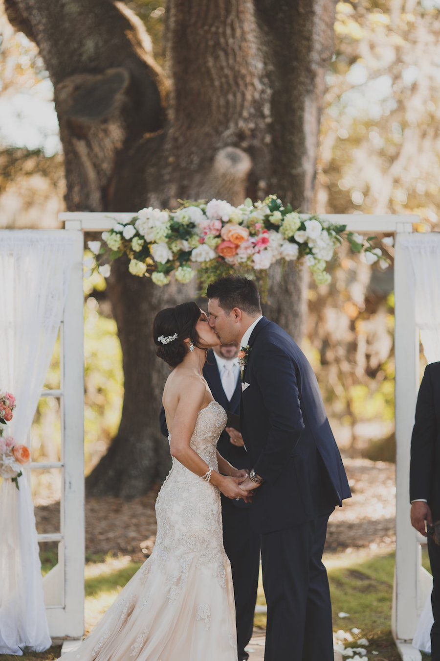 Rustic Outdoor Wedding Ceremony Bride and Groom First Kiss Portrait | Tampa Wedding Venue Cross Creek Ranch
