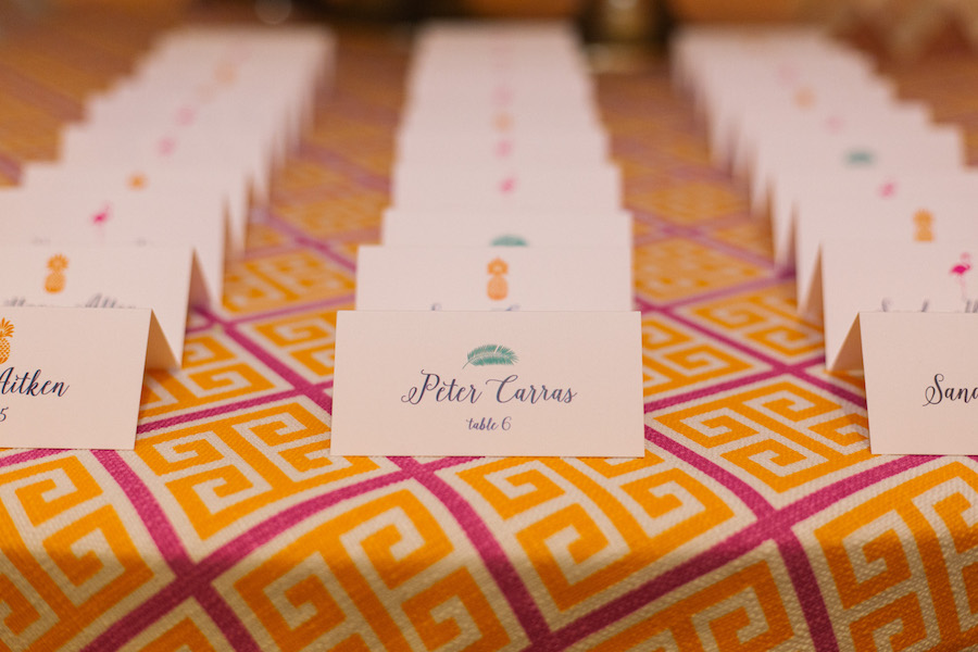 Tropical Pineapple and Palm Leave Wedding Escort Seating Cards on Orange and Pink Specialty Linen