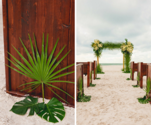 Oceanfront Tampa Bay Wedding Ceremony with Wooden Church Pews and Tropical Palm Bamboo Altar | Waterfront Wedding Venue Hilton Clearwater Beach | Rentals A Chair Affair