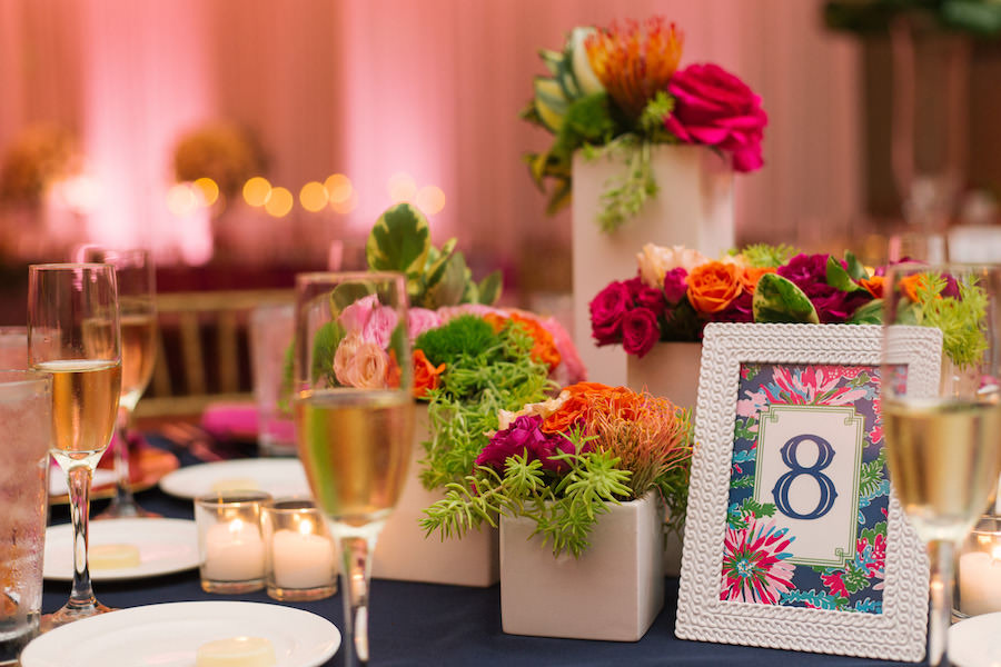Tropical Pink Wedding Reception Decor with Pink and Red Centerpieces and Blue Table Numbers | Clearwater Beach Hotel Wedding Venue | Hyatt Regency Clearwater