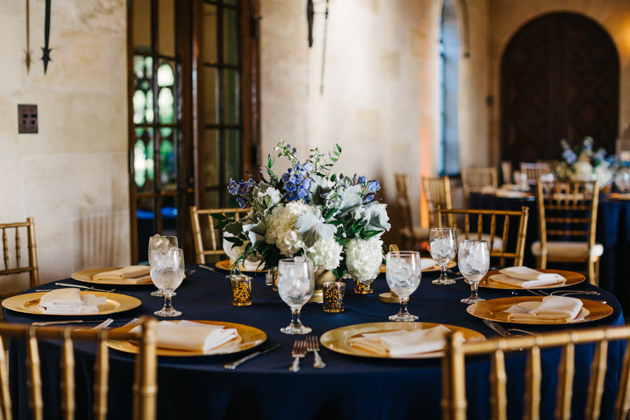 Elegant Wedding Reception Decor with Gold Chiavari Chairs, Navy Blue Table Linens, Gold Chargers, and Blue and White Floral Table Centerpieces | Sarasota Wedding Florist Apple Blossoms Floral Design | Wedding Planner Nicholle Leonard Designs
