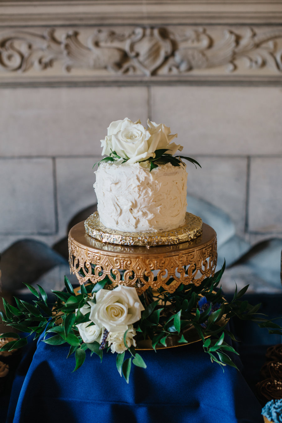 Single Tier, Round, White Wedding Cake on Gold Display with White Roses