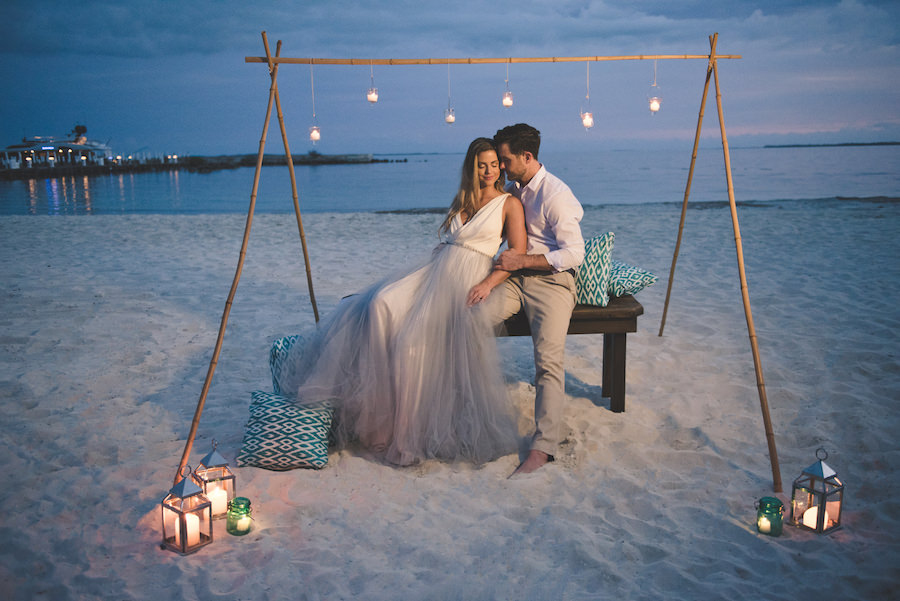 Bahamas Destination Beach Caribbean Wedding Venue Beachside Bonfire and Green Turquoise Lounge Seating with Bamboo Altar | Aisle Society Weddings Abaco Beach Resort
