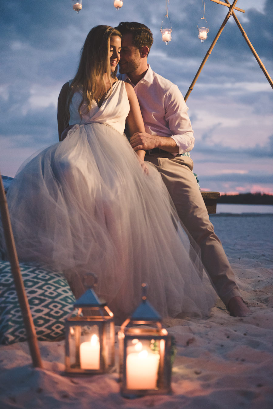 Bahamas Destination Beach Caribbean Wedding Venue Beachside Bonfire and Green Turquoise Lounge Seating with Bamboo Altar | Aisle Society Weddings Abaco Beach Resort