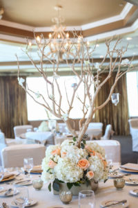St. Petersburg Reception Decor with Ivory and Coral Floral Centerpieces with Wooden Trees with Candles | St. Petersburg Wedding Venue Isla Del Sol Yacht and Country Club