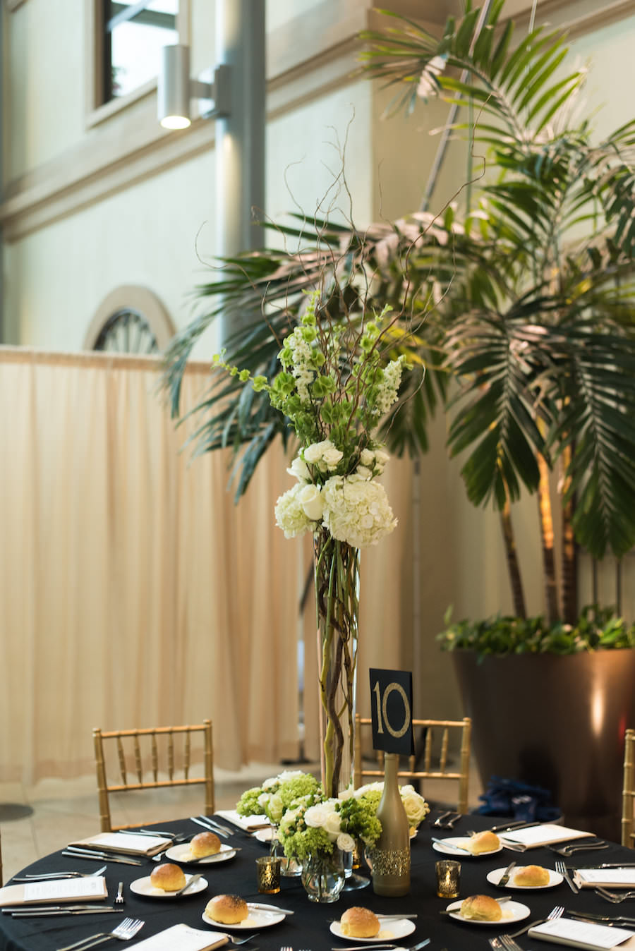 Tall White Hydrangea Wedding Centerpiece Flowers in Clear Vase | Black and White Wedding Décor | St Petersburg Wedding Photographer Caroline and Evan Photography