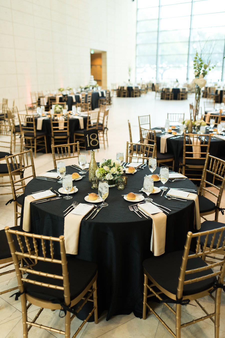 Black and White Wedding Reception with Black Linens and Gold Chiavari Chairs at St. Petersburg Wedding Venue Museum of Fine Arts | Photography by Caroline and Evan Photography