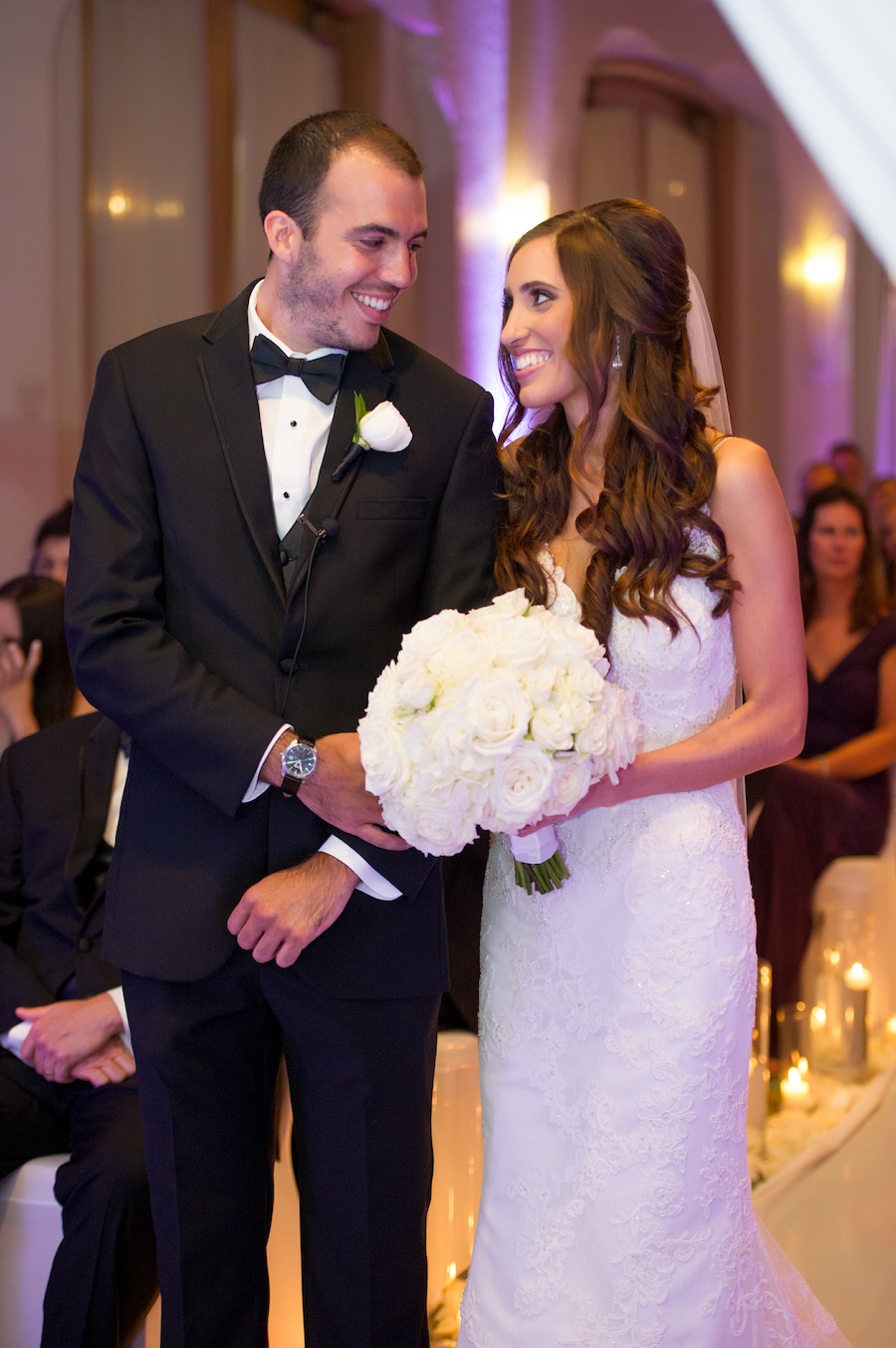 Bride and Groom During Indoor St. Pete Wedding Ceremony at Vinoy Renaissance with Candlelit Aisle