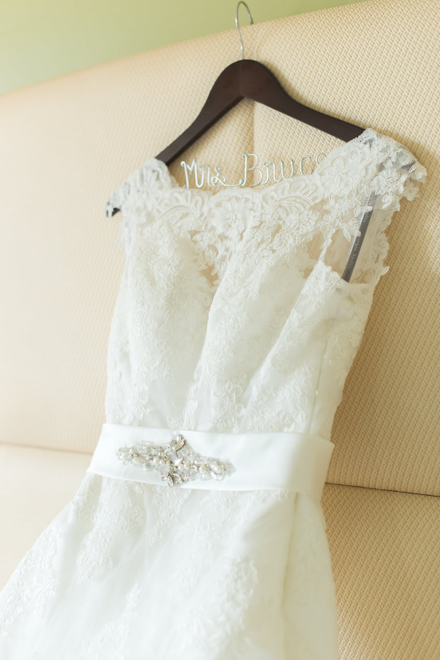 Ivory Lace Cap Sleeve Alfred Angelo Wedding Dress on Personalized Mrs. Hangar | St. Pete FL Wedding Photographer Caroline and Evan Photography