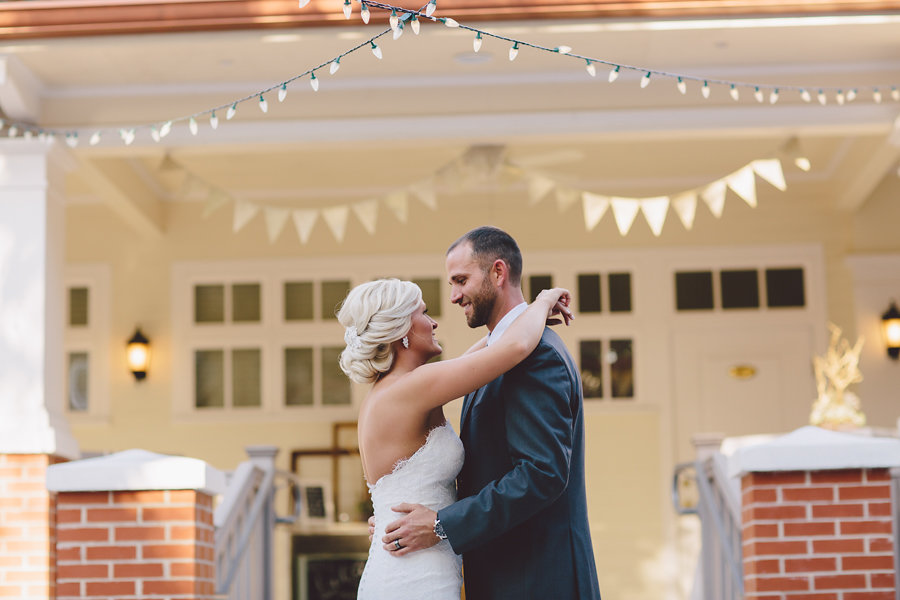Bride and Groom First Dance Wedding Portrait with Twinkle String Lights and Bunting | Waterfront Sarasota Wedding Venue Palmetto Riverside Bed and Breakfast