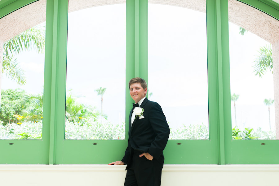 Groom Wedding Day Portrait in Black Tuxedo with Ivory Boutonniere | St. Petersburg Wedding Photographer Caroline and Evan Photography