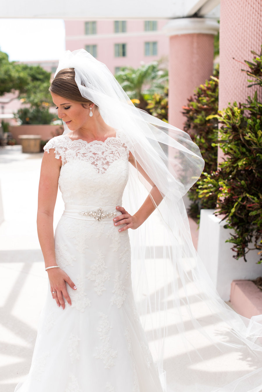 Bridal Wedding Portrait in Ivory Lace Alfred Angelo Wedding Dress with Cap Sleeves and Rhinestone Belt | St. Petersburg Wedding Photographer Caroline and Evan Photography | Wedding Hair and Makeup Michele Renee The Studio