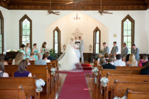 Bride and Groom Ceremony Exchanging Vows at Dunedin Historic Wedding Ceremony Church Venue St. Andrew's Memorial Chapel
