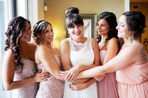 Bride and Bridesmaids Wedding Portrait in White, Lace Wedding Dress and Blush Colored Bridesmaids Dresses at St. Petersburg Wedding