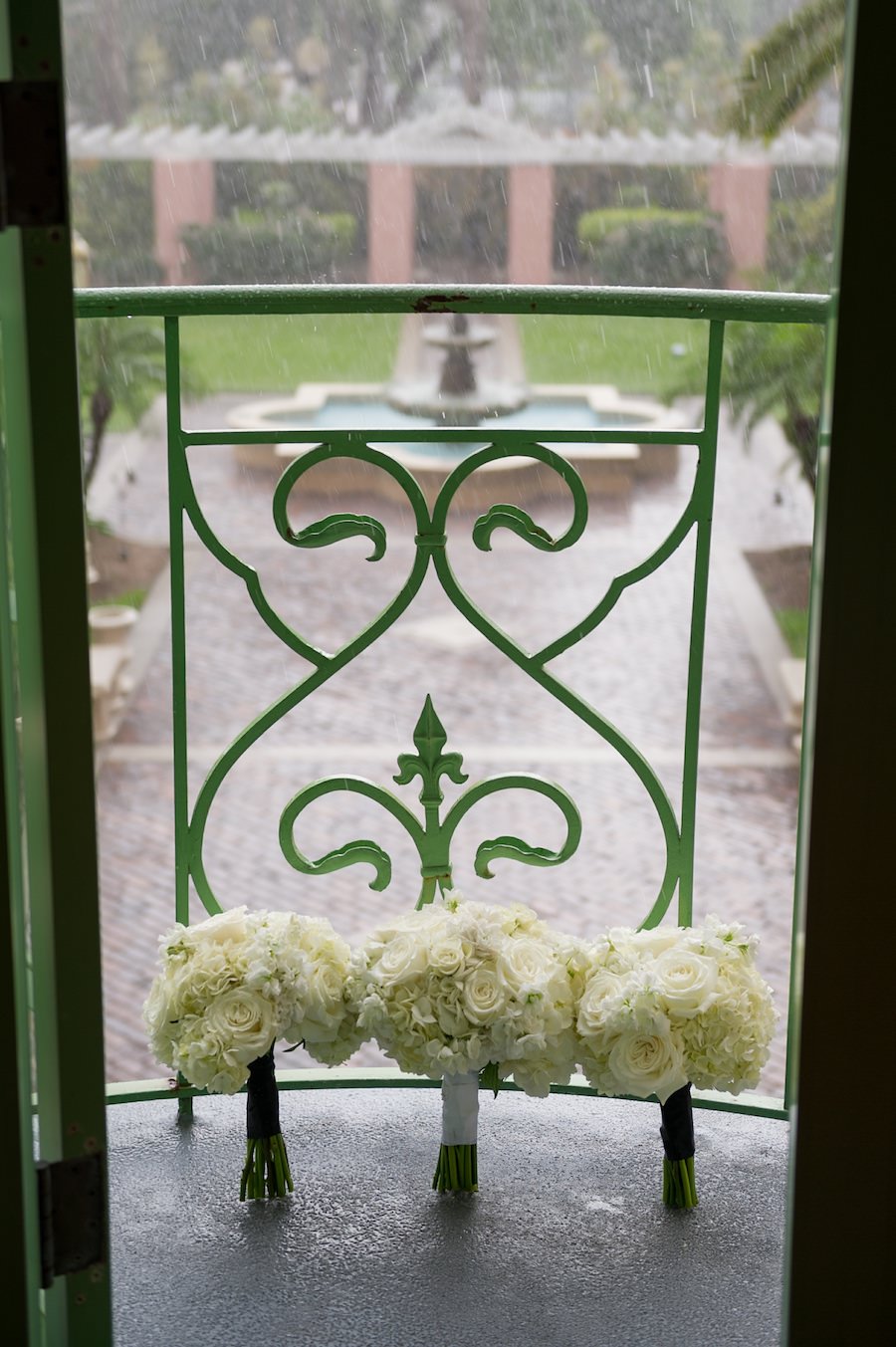 White Rose Wedding Bouquet on Vinoy Renaissance Balcony on Rainy Wedding Day