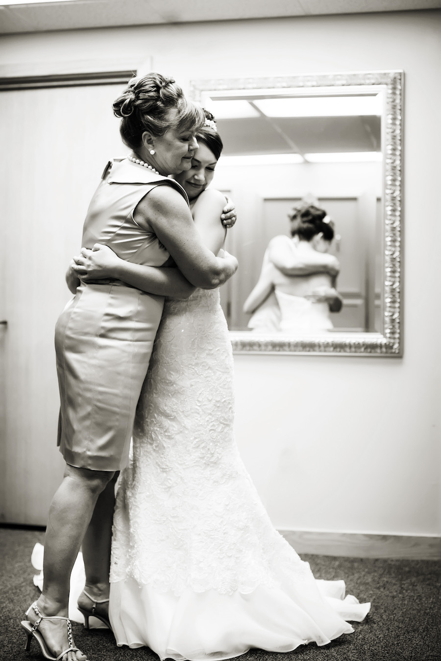 Bride and Mother Hugging Embrace Wedding Portrait | Tampa Wedding Photographer Limelight Photography