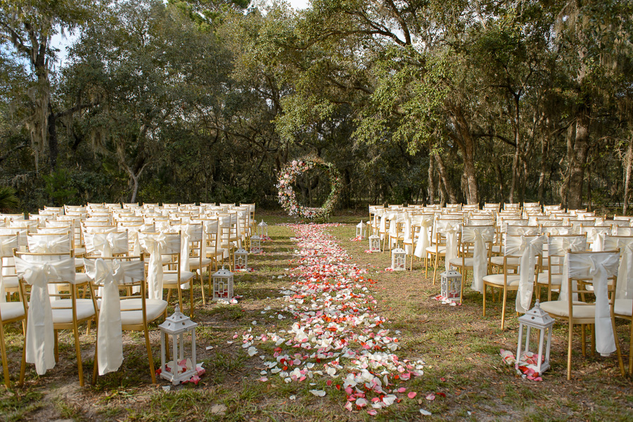 Outdoor, Spring Hill Wedding Ceremony with Gold Chiavari Chairs, Floral Wreath and Rose Petal Aisle
