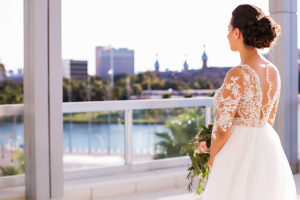 Bride Portrait in Illusion Wedding Dress Over Looking Downtown Tampa | Rooftop Wedding Venue The Glazer Children's Museum | Bridal Wedding Dress Shop Isabel O'Neil Bridal | Wedding Photographer Limelight Photography