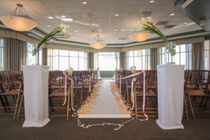 Indoor, St. Petersburg Wedding Ceremony with Aisle of Flowers and Cally Lily Centerpieces at St. Pete Wedding Venue Isla Del Sol Yacht and Country Club