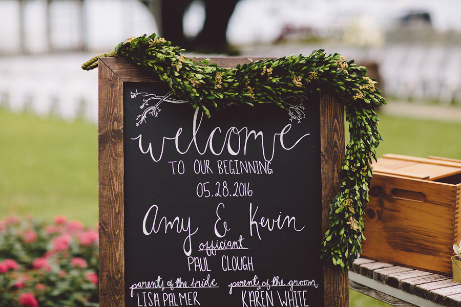 Wooden Chalkboard Welcome Wedding Reception Sign with Greenery and Calligraphy