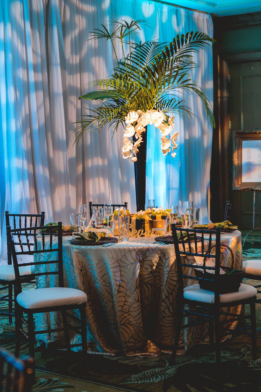 Ballroom Tampa Bay Indoor Wedding Reception with Tall Palm Centerpiece Decor and Chiavari Chairs | Waterfront Wedding Venue Hyatt Regency Clearwater Beach | Wedding Planner Special Moments Event Planning | Apple Blossom Floral Designs | Signature Event Rentals