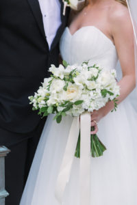 Bride and Groom Wedding Portrait in White, Tulle Wedding Dress, Ivory and White Bridal Bouquet and Black Groom's Tux