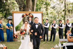 Bride and Groom Walking Down Aisle at Outdoor, Rustic Wedding Ceremony | Tampa Wedding Venue Cross Creek Ranch