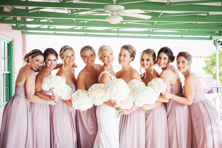 Bridal Party Wedding Portrait with Dusty Rose Watters Bridesmaids Dresses and Ivory Sleeveless Mikaella Wedding Dress and White Rose Bouquets | St. Petersburg Wedding Photographer Limelight Photography