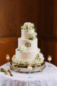 Three Tiered, White, Round Wedding Cake with Ivory Floral Accents