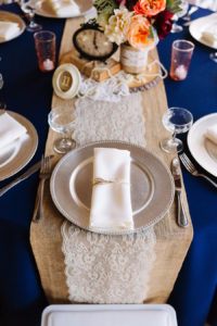 Vintage Rustic Wedding Reception Centerpiece Decor with Burlap Table Runner with Lace, Silver Charger and Antique Clock Centerpiece